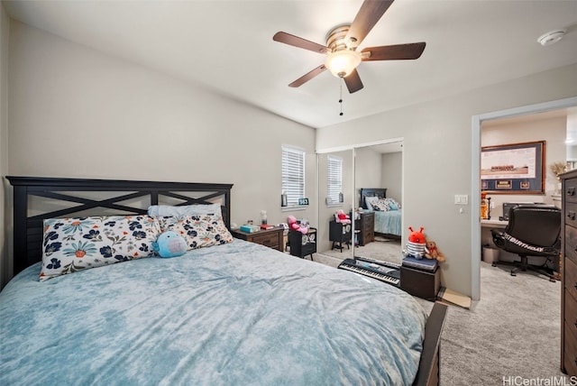 carpeted bedroom with a closet and ceiling fan