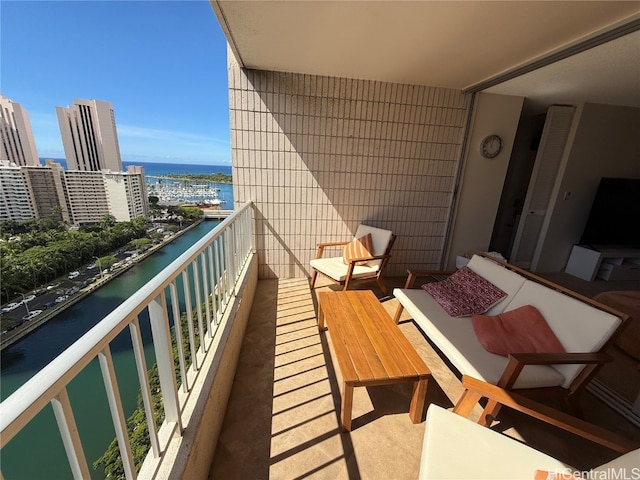 balcony featuring a water view