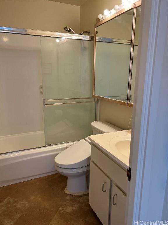 full bathroom with vanity, tile patterned flooring, shower / bath combination with glass door, and toilet