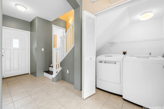 laundry area with light tile patterned flooring and independent washer and dryer