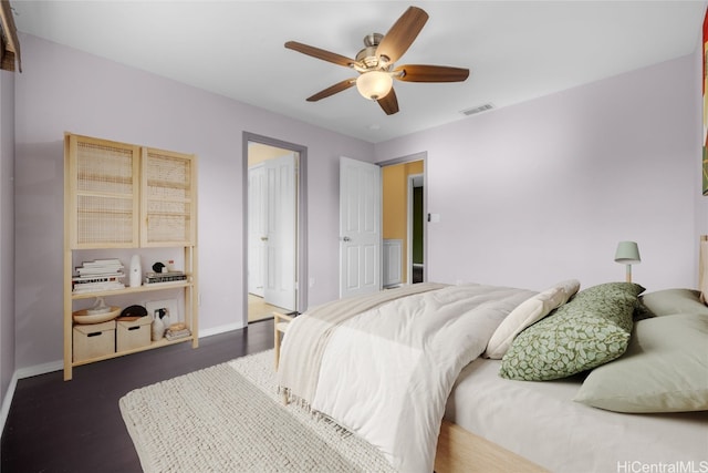 bedroom featuring dark wood-type flooring and ceiling fan