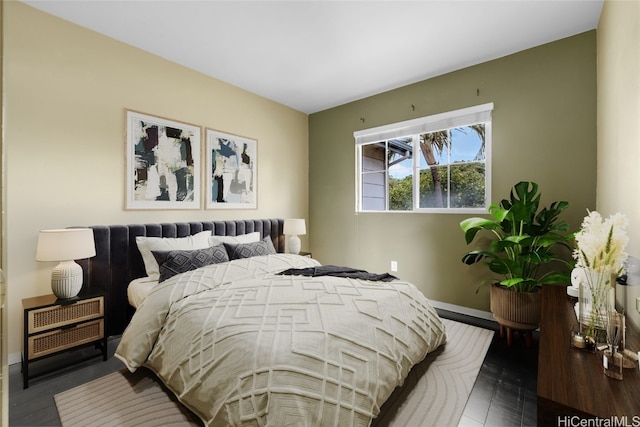 bedroom featuring dark hardwood / wood-style flooring