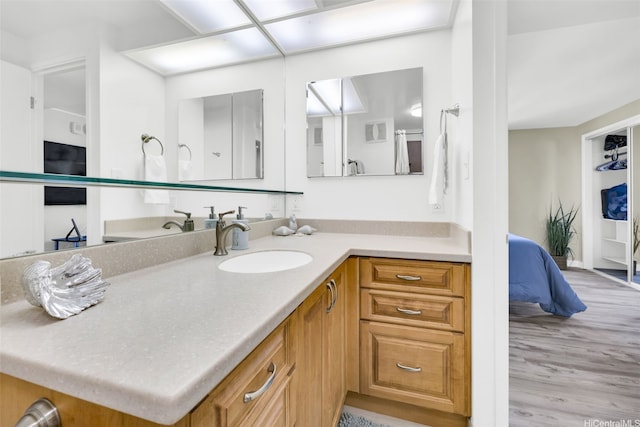 2724 Kahoaloha Ln Unit 1007, Honolulu, HI 96826 - bathroom featuring wood finished floors and vanity