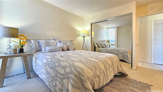 bedroom with light carpet and a closet