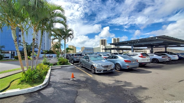 view of parking / parking lot with a carport