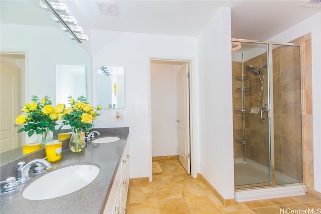 bathroom featuring vanity and a shower with shower door