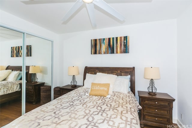 bedroom featuring dark wood-type flooring, a closet, and ceiling fan