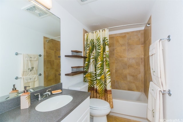 full bathroom with toilet, shower / bath combo with shower curtain, vanity, and tile patterned flooring