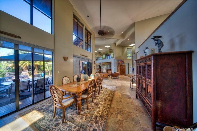 dining area featuring a high ceiling