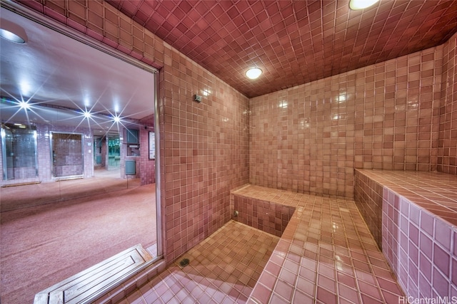 bathroom with tile walls