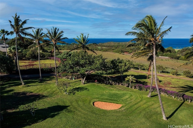 view of property's community featuring a water view and a yard