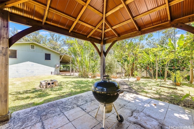 view of patio / terrace with a gazebo, an outdoor fire pit, and a grill