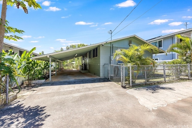 view of property exterior with a carport