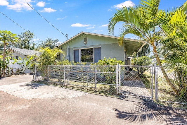 2127 California Ave Unit B, Wahiawa, HI 96786 - view of front of property with driveway, a gate, concrete block siding, and a fenced front yard