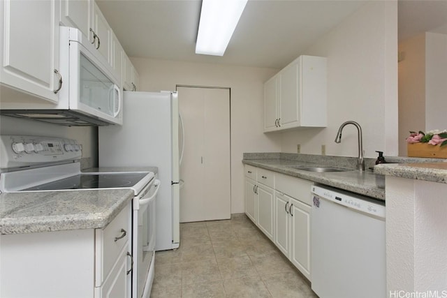 kitchen with light countertops, white appliances, a sink, and white cabinets