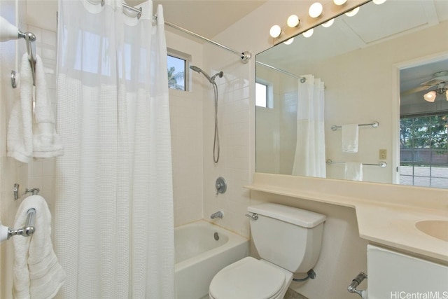 full bath with shower / tub combo with curtain, vanity, and toilet