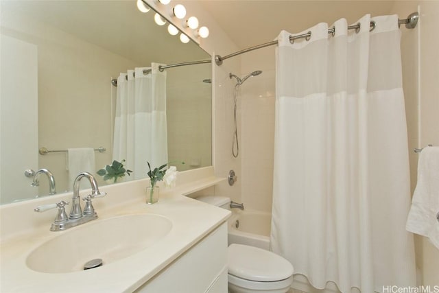 bathroom with vanity, toilet, and shower / bathtub combination with curtain