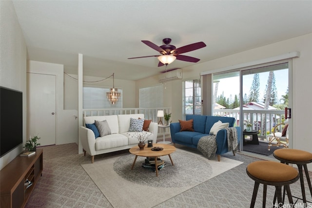 carpeted living room featuring ceiling fan with notable chandelier and a wall unit AC