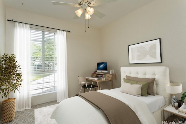 bedroom featuring ceiling fan and light colored carpet