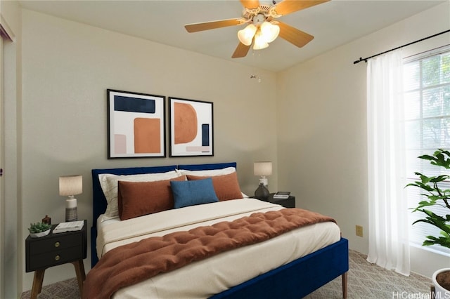 carpeted bedroom featuring a ceiling fan