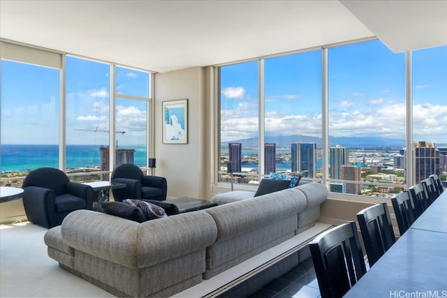 living room with expansive windows and a water view