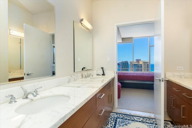 bathroom with vanity and tile patterned flooring