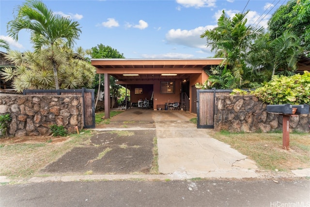 view of vehicle parking featuring a carport