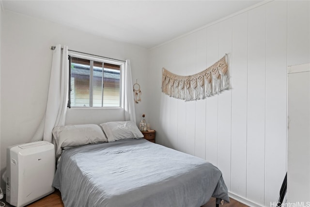 bedroom with hardwood / wood-style flooring