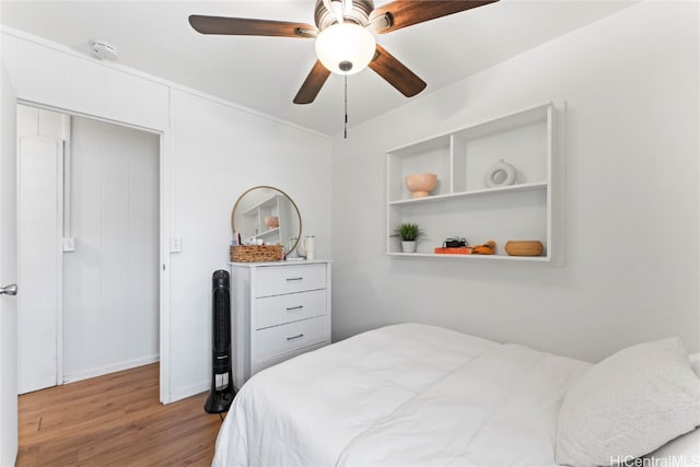 bedroom featuring light hardwood / wood-style floors and ceiling fan