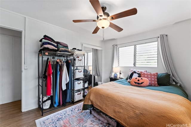 bedroom featuring ceiling fan and wood-type flooring