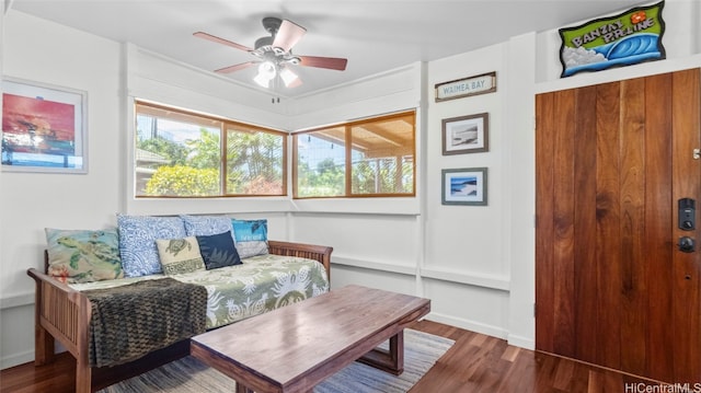 interior space featuring wood-type flooring and ceiling fan