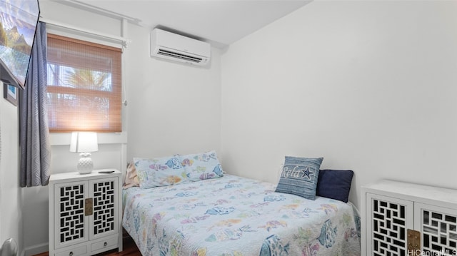 bedroom with a wall unit AC