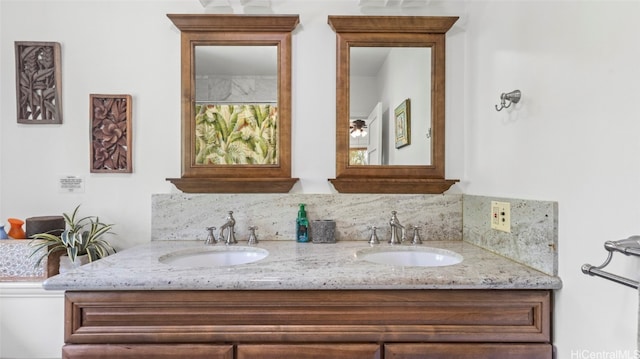 bathroom featuring vanity and decorative backsplash