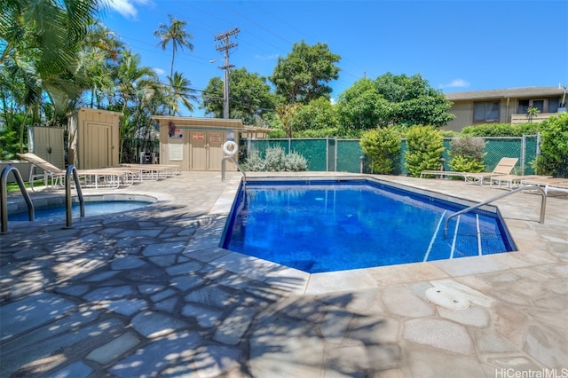 view of swimming pool with a patio