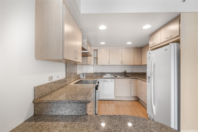 1314 Kalakaua Ave Unit 513, Honolulu, HI 96826 - kitchen featuring white appliances, wall chimney exhaust hood, light brown cabinets, and recessed lighting