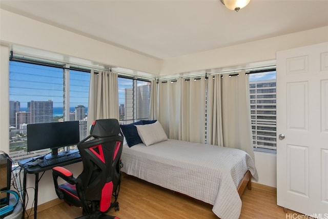 bedroom with wood-type flooring