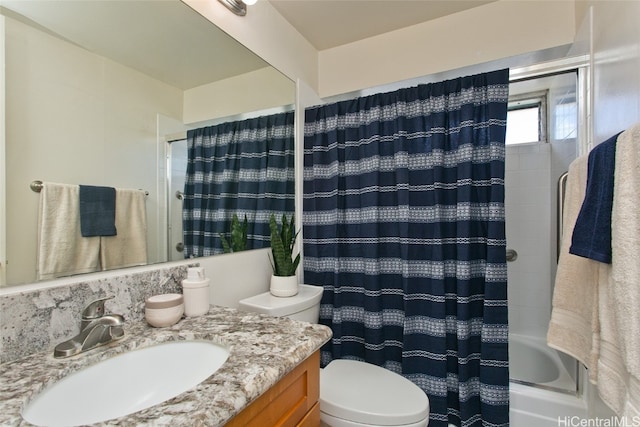 full bathroom featuring shower / tub combo, vanity, and toilet