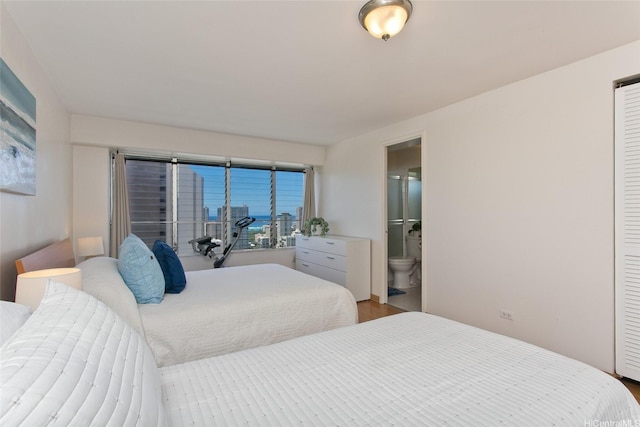 2525 Date St Unit 3706, Honolulu, HI 96826 - bedroom featuring ensuite bath and wood finished floors