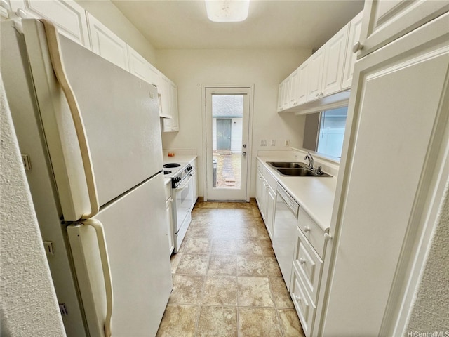 91-1051 Keoneula Blvd Unit E3, Ewa Beach, HI 96706 - kitchen with white appliances, light countertops, and white cabinets