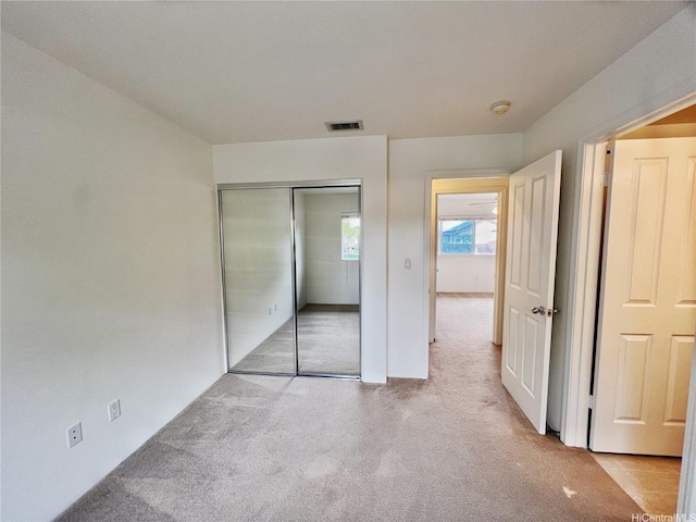 91-1051 Keoneula Blvd Unit E3, Ewa Beach, HI 96706 - unfurnished bedroom featuring light carpet and a closet