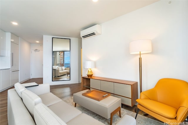 living room featuring a wall unit AC and hardwood / wood-style floors