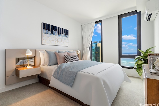 carpeted bedroom featuring a water view and a wall mounted air conditioner