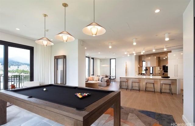 game room with light wood-type flooring, recessed lighting, rail lighting, and billiards