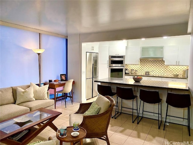 living room with light tile patterned floors