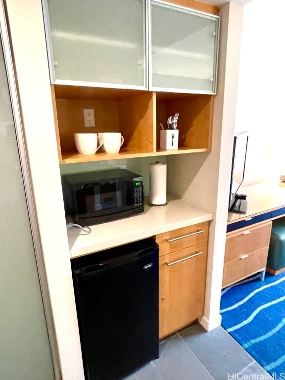 bar with dishwasher and tile patterned flooring