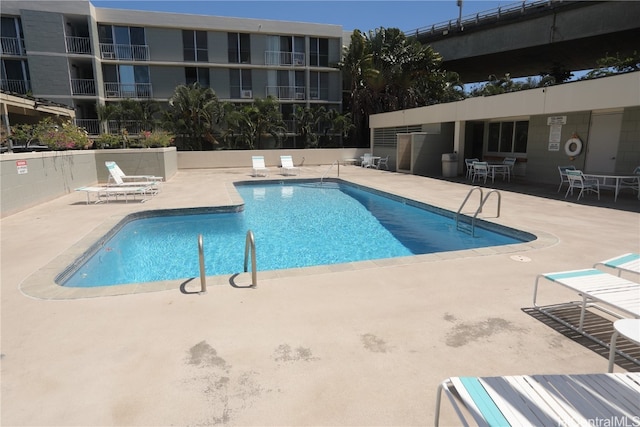 view of pool featuring a patio area