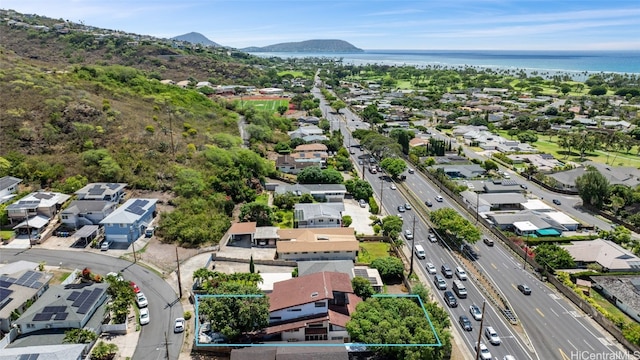 aerial view featuring a water and mountain view