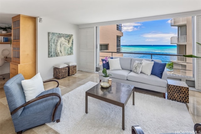 tiled living room with a water view