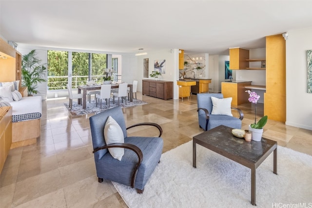 living room featuring floor to ceiling windows