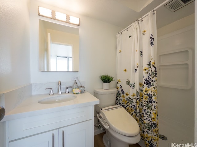 bathroom with vanity, a shower with curtain, and toilet